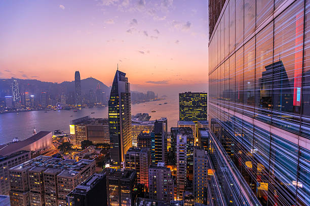 Victoria Harbour at sunset with the Hong Kong Island skyline