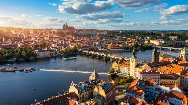Aerial view across Prague and the Vltava in warm afternoon light